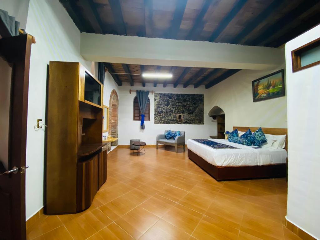 Postel nebo postele na pokoji v ubytování HOTEL EX HACIENDA EL MOLINO