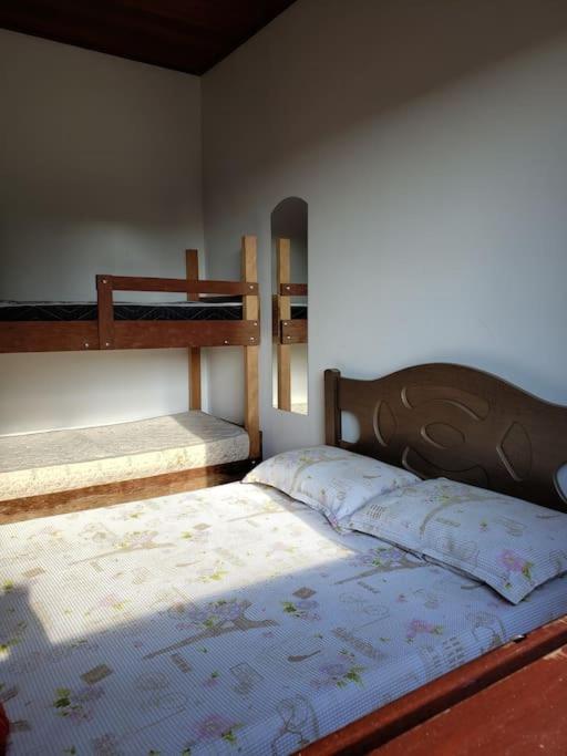 Postel nebo postele na pokoji v ubytování Chácara, próx a SP, com WI-FI e uma vista incrível