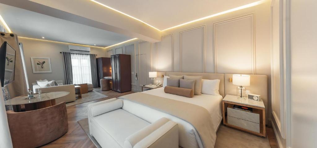 Postel nebo postele na pokoji v ubytování Hotel Maria Camille