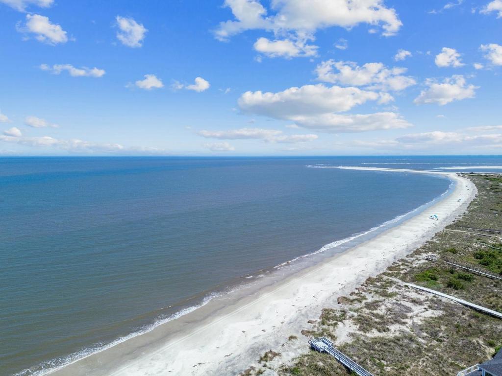 an aerial view of a beach with the ocean at Lowcountry State of Mind luxury beach getaway located on Harbor Island, South Carolina in St. Helena Island