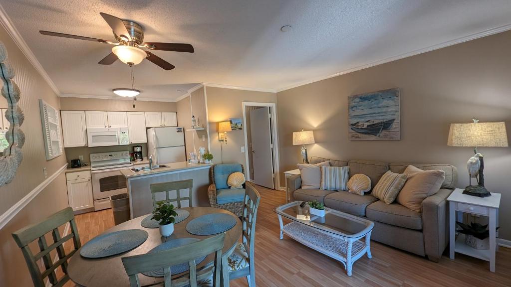 a living room with a couch and a table at Ocean Dunes Villas in Hilton Head Island
