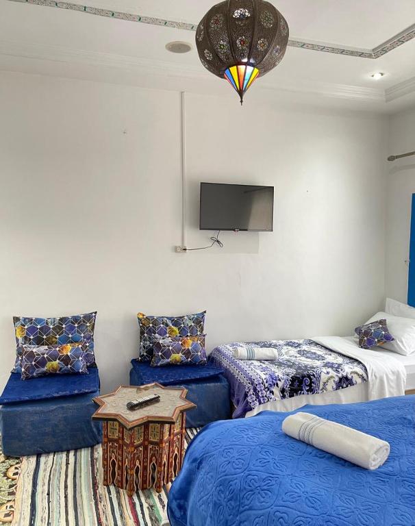 Postel nebo postele na pokoji v ubytování Riad Blue Oasis