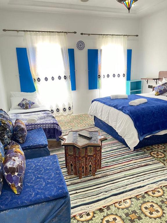 Postel nebo postele na pokoji v ubytování Riad Blue Oasis
