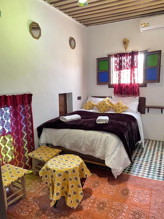 Postel nebo postele na pokoji v ubytování Riad Blue Oasis