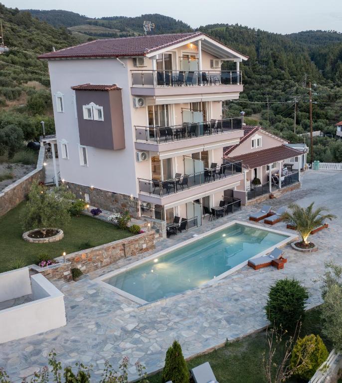 an aerial view of a house with a swimming pool at Art Studios in Neos Marmaras