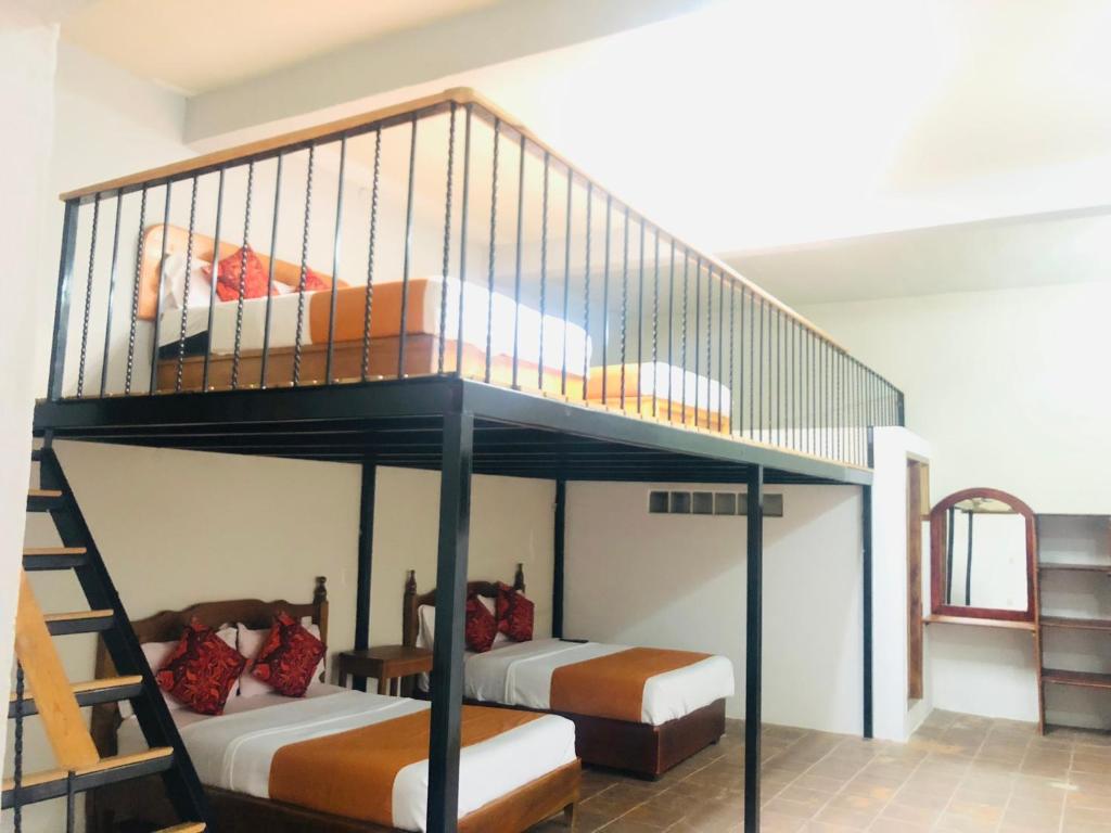 Postel nebo postele na pokoji v ubytování HOTEL EX HACIENDA EL MOLINO