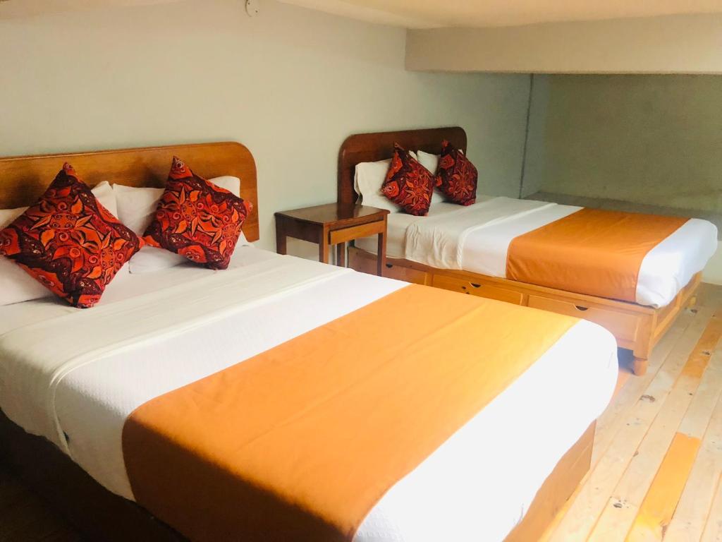 Postel nebo postele na pokoji v ubytování HOTEL EX HACIENDA EL MOLINO