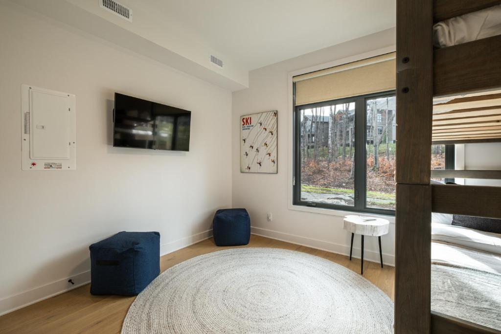 Postel nebo postele na pokoji v ubytování Tremblant Prestige - Verbier 4-102
