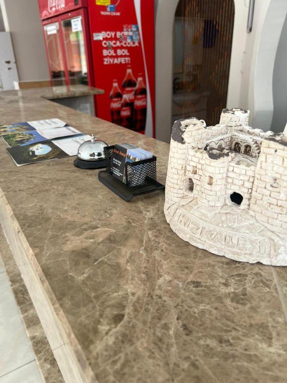 a model of a building on a table at Rose Hotel in Erdemli