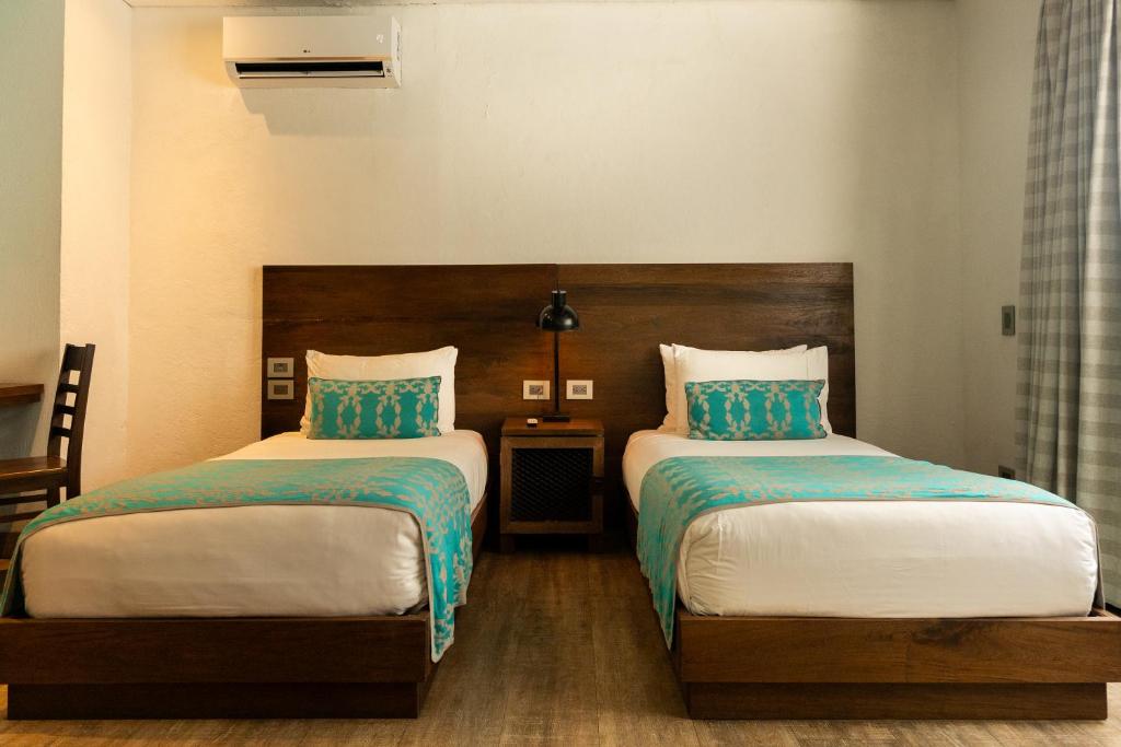 Postel nebo postele na pokoji v ubytování Sophia Hotel