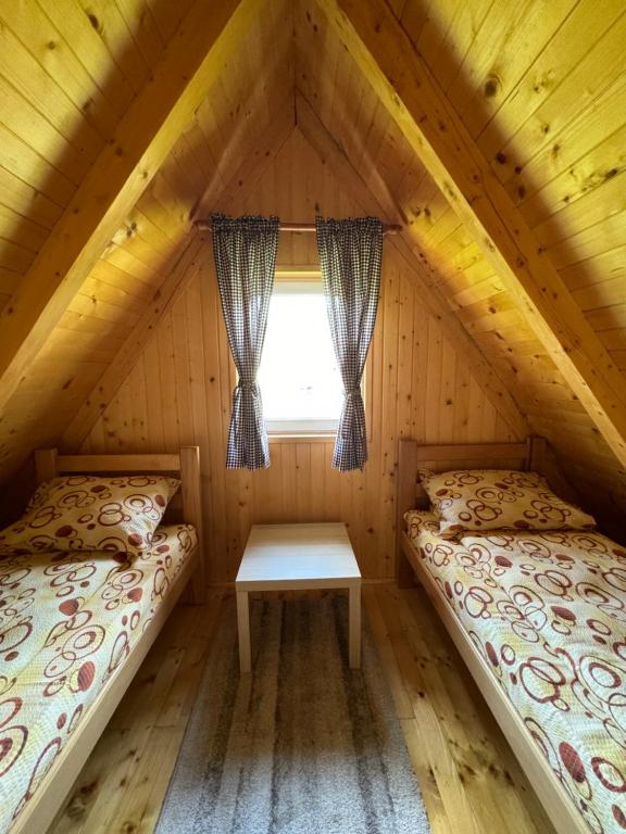 Postel nebo postele na pokoji v ubytování Mountain Houses Šarović