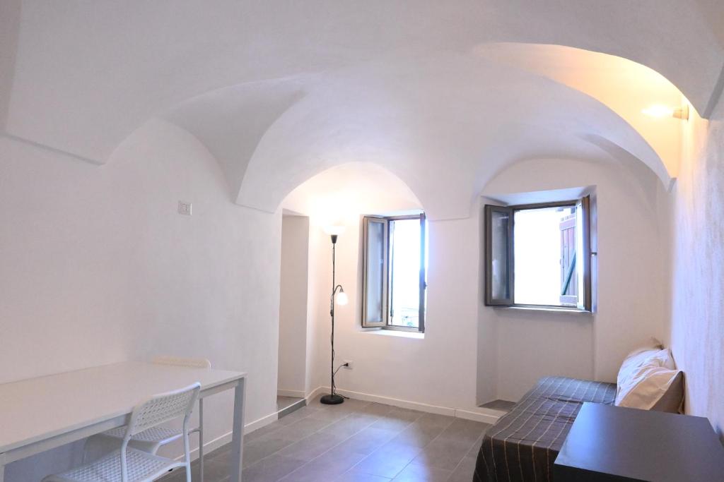 Postel nebo postele na pokoji v ubytování Casa dell'Arco