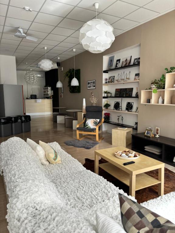 a living room with a couch and a table at Hotel Augustus in Milano Marittima