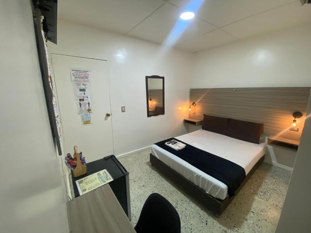 Cama o camas de una habitación en Hotel Tamaiti