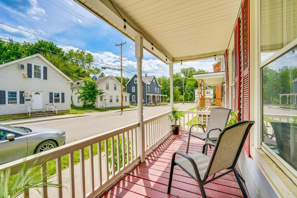 a porch with chairs and a car on a street at Bennington Gem with Smart TV Near Historic District! in Bennington