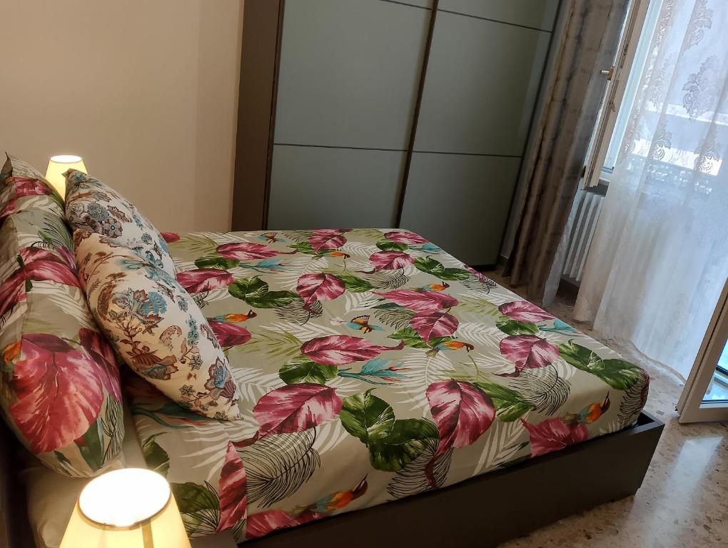 a couch with a blanket on top of it at Sun House in Montesilvano