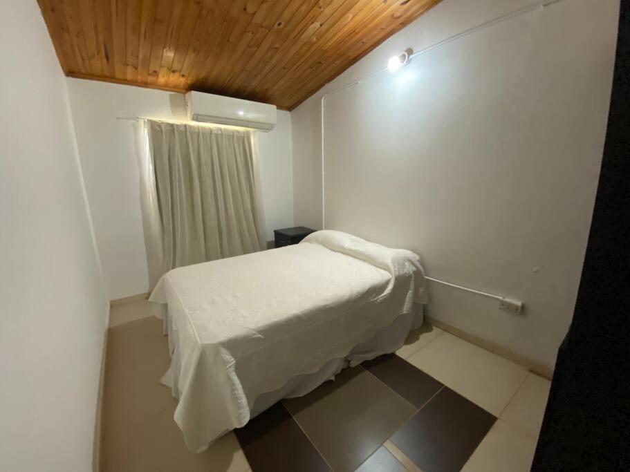 En eller flere senge i et værelse på Departamento 2 Pellegrini