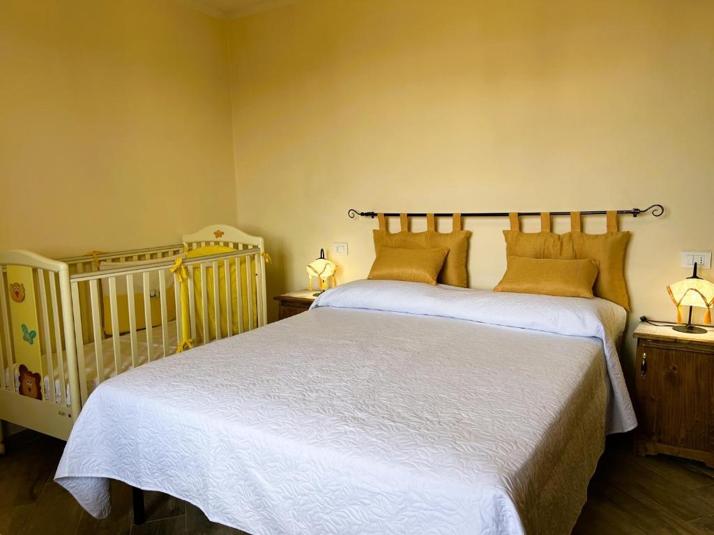 Postel nebo postele na pokoji v ubytování Casina di Desiree e Aurora