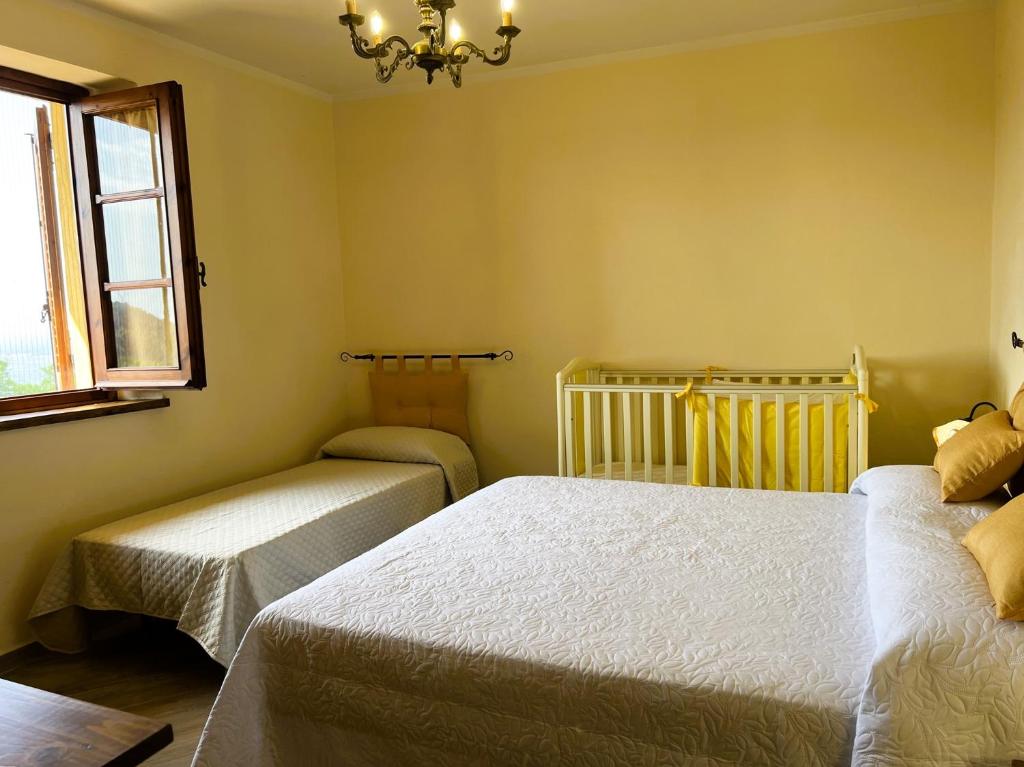 Postel nebo postele na pokoji v ubytování Casina di Desiree e Aurora