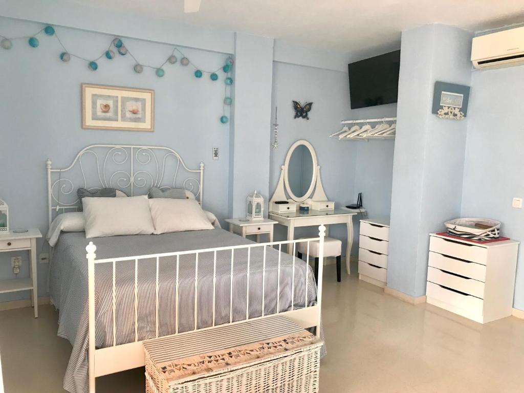 A bed or beds in a room at Apartamento DUPLEX CRUZ DEL MAR