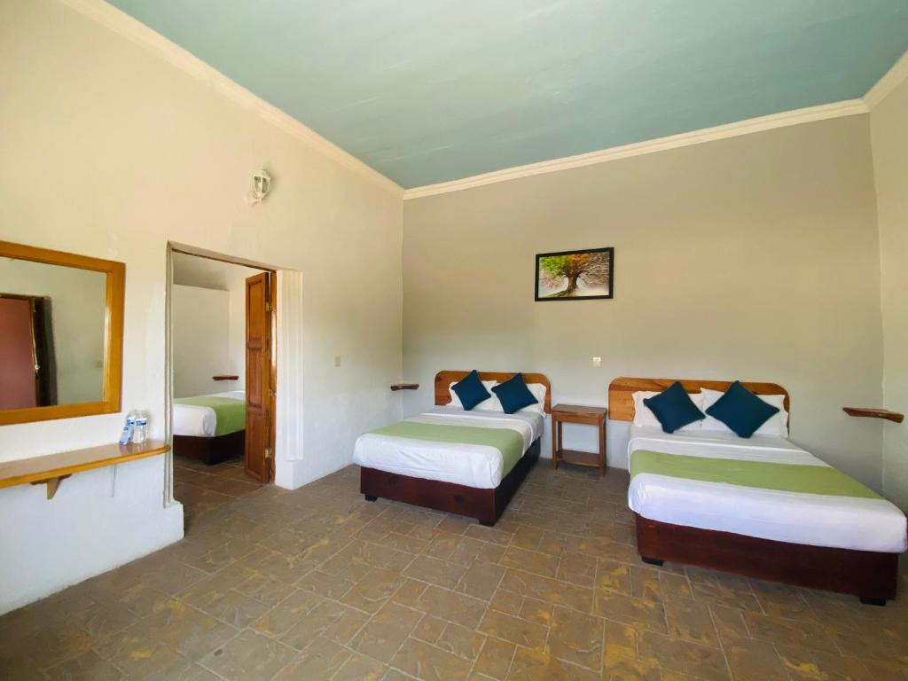 Postel nebo postele na pokoji v ubytování HOTEL EX HACIENDA EL MOLINO