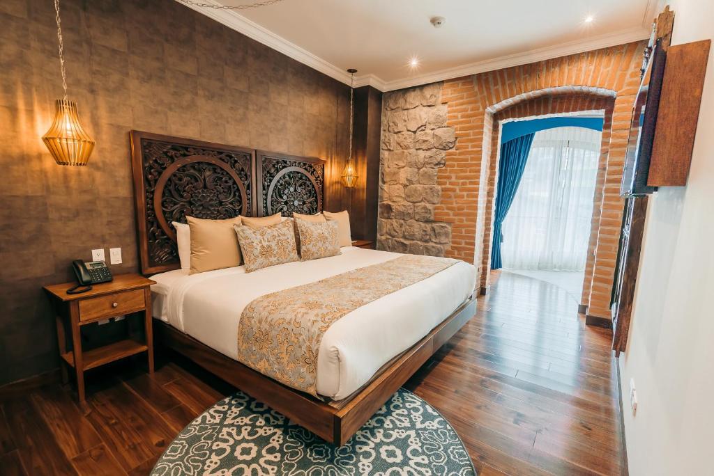 Postel nebo postele na pokoji v ubytování Hotel Otavalo