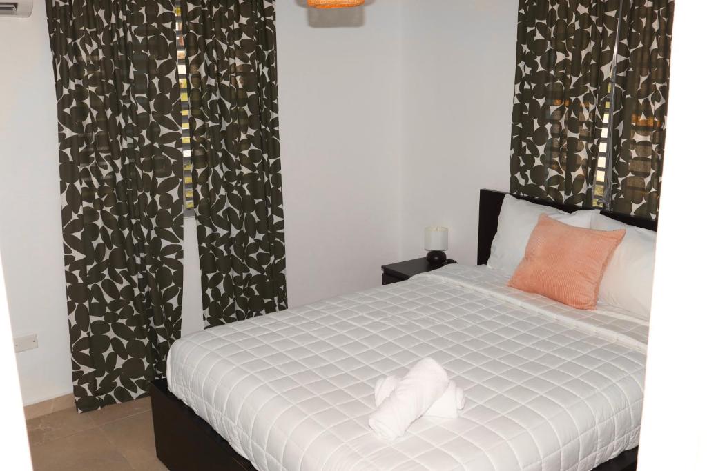 Postel nebo postele na pokoji v ubytování Villas Boqueyé