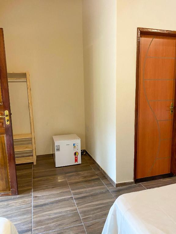 Postel nebo postele na pokoji v ubytování Chalé Mascarenhas