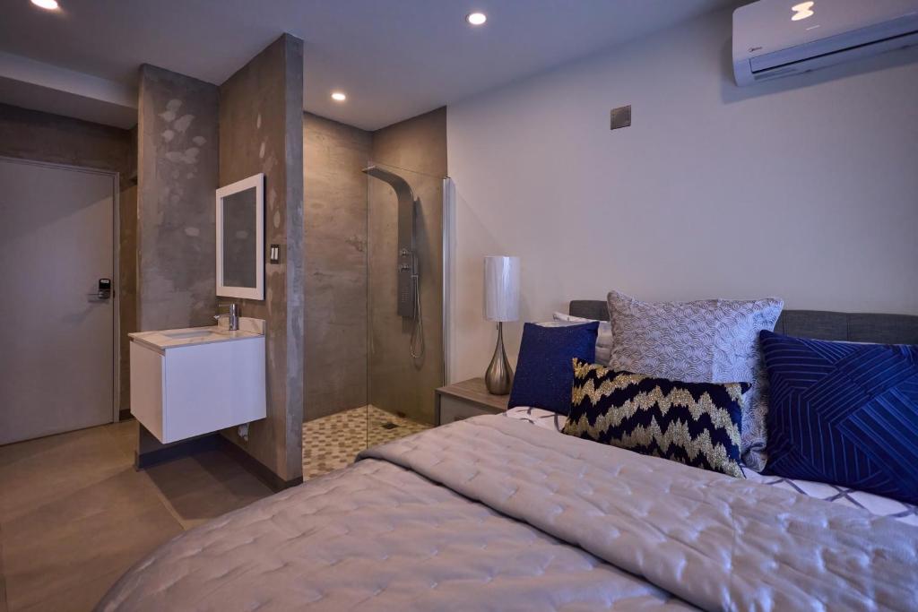 Postel nebo postele na pokoji v ubytování Ola Boutique Hotel