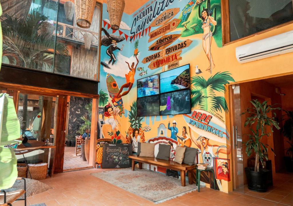 a room with a wall with a mural on it at Casa Pepe in Sayulita