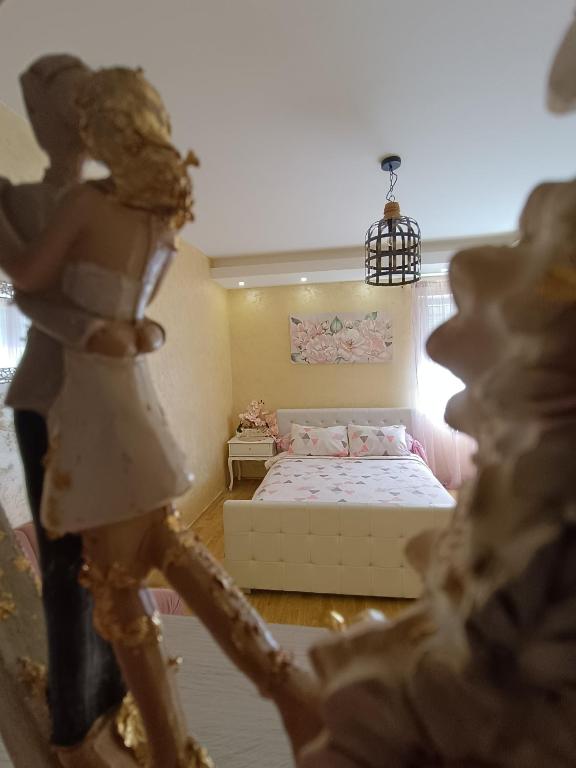 Postel nebo postele na pokoji v ubytování Apartman Golden Rose