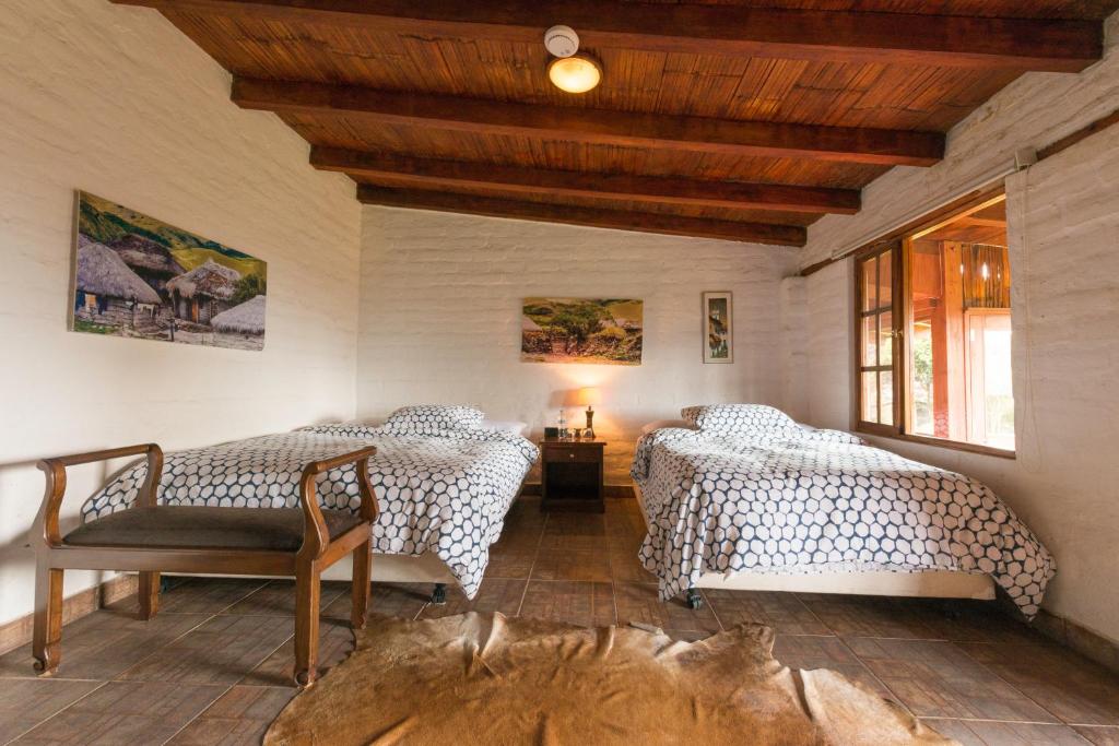 Postel nebo postele na pokoji v ubytování Hacienda El Rejo