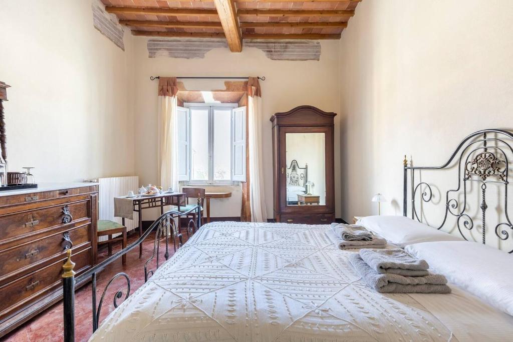 Postel nebo postele na pokoji v ubytování Palazzo Ninci