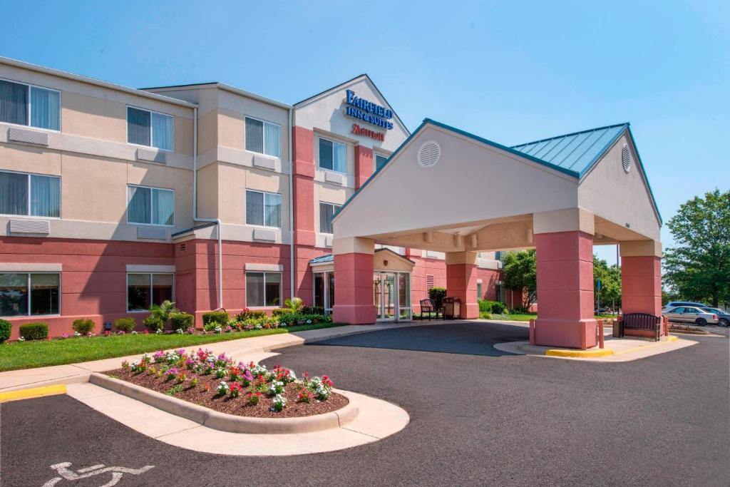 a hotel building with flowers in front of it at Fairfield Inn Dulles Airport Chantilly in Chantilly