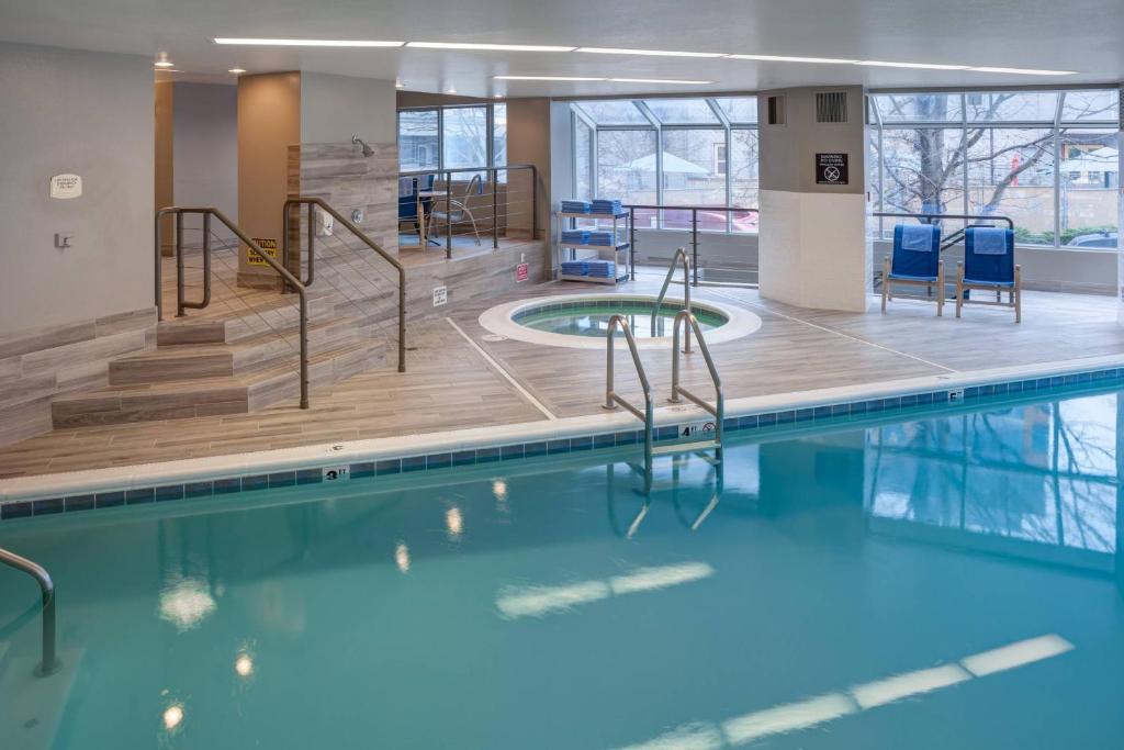 a swimming pool with blue water in a building at Residence Inn by Marriott Seattle Downtown/Lake Union in Seattle