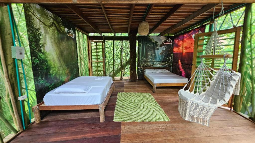 Postel nebo postele na pokoji v ubytování Cabaña en el arbol del Tacana