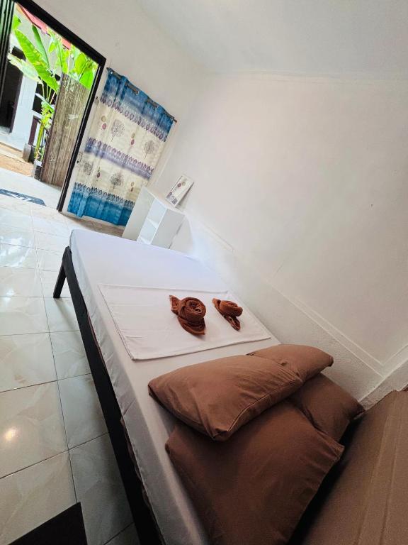 Postel nebo postele na pokoji v ubytování Paradiso Hostel El nido