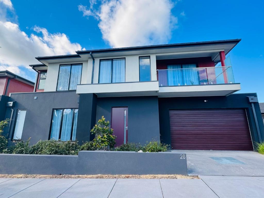 a house with a garage in front of it at ‘The bayside’ Beautifully brand new house in Mentone