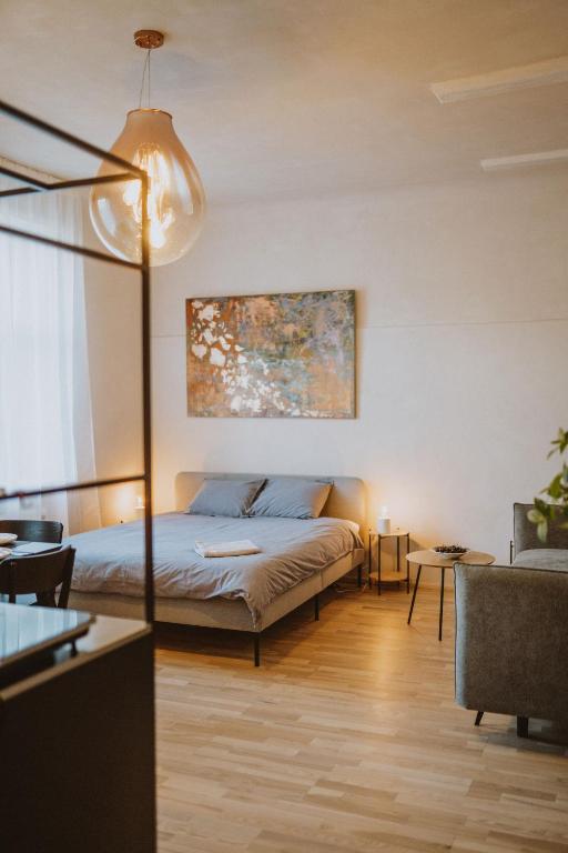 a bedroom with a bed in a room at Garden House Apartments in Cēsis