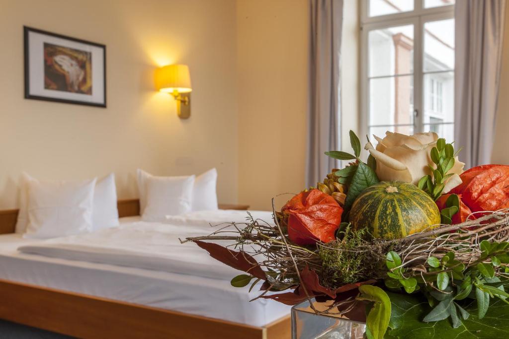 Postel nebo postele na pokoji v ubytování Kurhaushotel Bad Salzhausen
