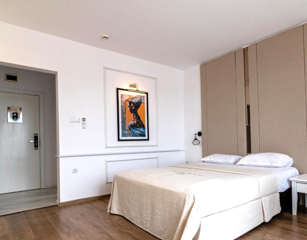 Säng eller sängar i ett rum på Hotel AVENUE