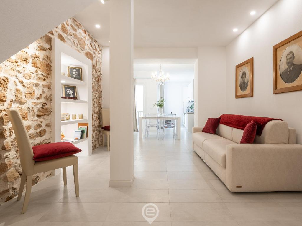 a living room with a couch and a chair at Dimora della Gherardesca in Iglesias