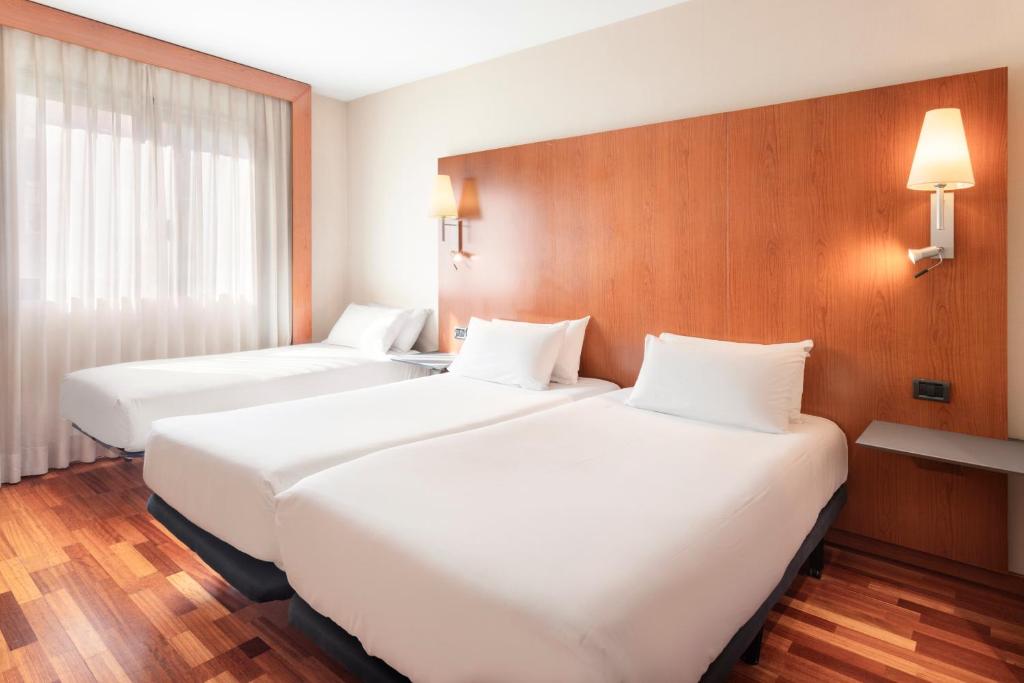 Postel nebo postele na pokoji v ubytování B&B HOTEL Ciudad de Lleida