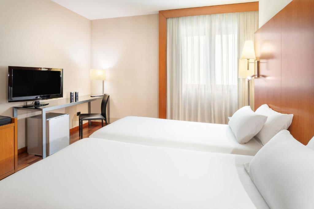 Postel nebo postele na pokoji v ubytování B&B HOTEL Ciudad de Lleida