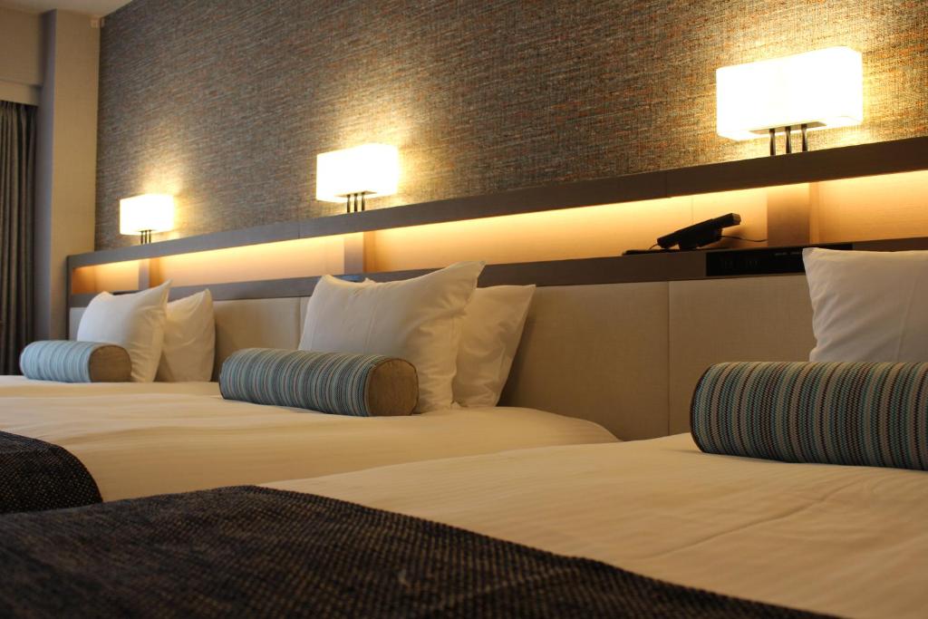 Postel nebo postele na pokoji v ubytování Hotel Sardonyx Tokyo