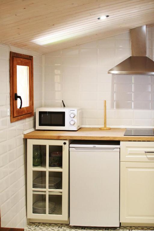 Una cocina o zona de cocina en El Celler de la Guàrdia