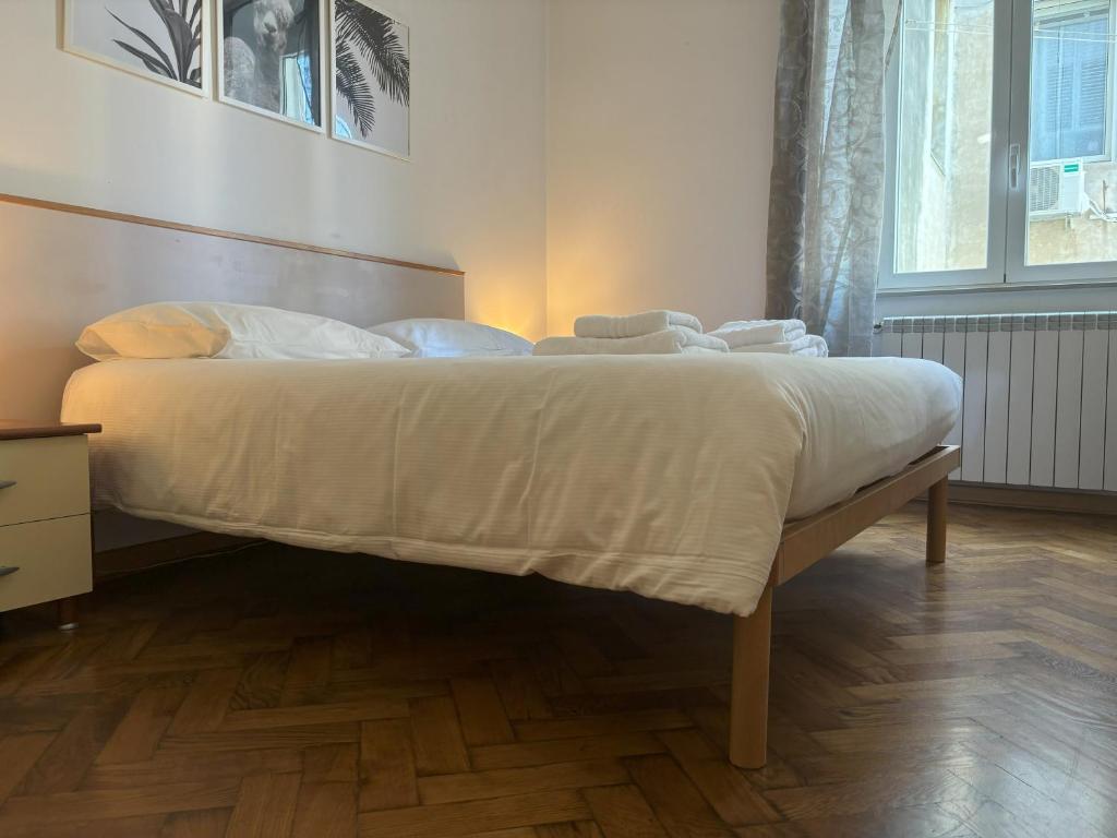 Posteľ alebo postele v izbe v ubytovaní Flat Belpoggio 13