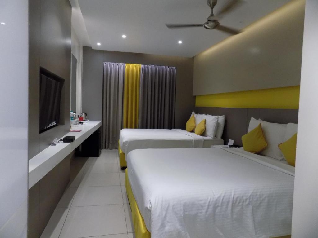 Postel nebo postele na pokoji v ubytování ZIBE Coimbatore by GRT Hotels