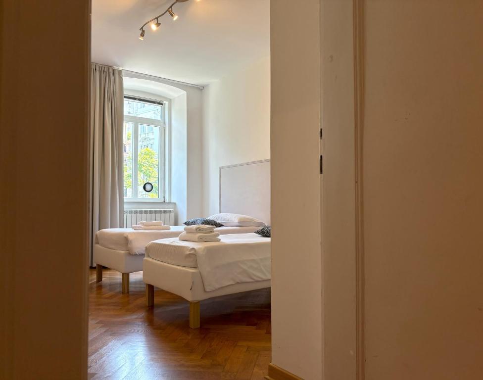 Posteľ alebo postele v izbe v ubytovaní Flat Belpoggio 13