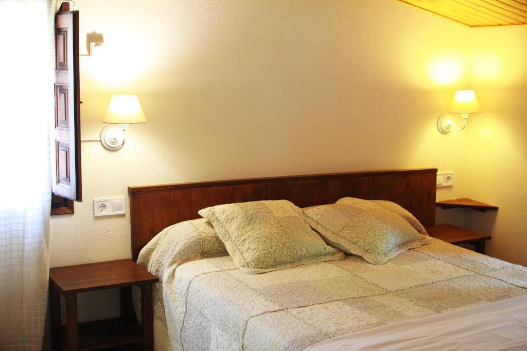 Cama o camas de una habitación en El Celler de la Guàrdia